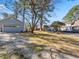 Spacious backyard with a detached garage and a deck offers ample outdoor space at 150 Forest Ridge Ct, Lawrenceville, GA 30046