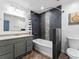 Bathroom with gray vanity, modern tilework, and a shower-tub combination at 150 Forest Ridge Ct, Lawrenceville, GA 30046