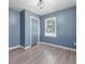 Bedroom with gray walls, wood floors, a large window, and a closet at 150 Forest Ridge Ct, Lawrenceville, GA 30046