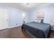 Inviting bedroom with ensuite bathroom and blue accents, creating a peaceful retreat for rest and relaxation at 150 Forest Ridge Ct, Lawrenceville, GA 30046