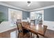 Charming dining room with hardwood floors and natural light, ideal for Gathering gatherings and entertaining guests at 150 Forest Ridge Ct, Lawrenceville, GA 30046