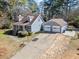 Inviting one-story home with a detached two-car garage and well-maintained landscaping at 150 Forest Ridge Ct, Lawrenceville, GA 30046