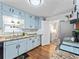 Well-organized kitchen with granite countertops, subway tile, blue cabinets, and stainless steel appliances at 150 Forest Ridge Ct, Lawrenceville, GA 30046