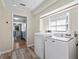 Functional laundry room with modern appliances and ample natural light, making laundry tasks more enjoyable at 150 Forest Ridge Ct, Lawrenceville, GA 30046