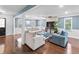 Cozy living room with ample seating, hardwood floors, and natural light at 150 Forest Ridge Ct, Lawrenceville, GA 30046
