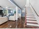 Bright living room with hardwood floors and a staircase at 150 Forest Ridge Ct, Lawrenceville, GA 30046