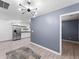 Open-concept living area featuring tile floors and stainless steel appliances at 150 Forest Ridge Ct, Lawrenceville, GA 30046