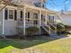 A close-up shot shows the inviting front porch of the home at 150 Forest Ridge Ct, Lawrenceville, GA 30046