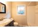 Bathroom with dark vanity and shower-tub combo at 391 Oak Dr, Social Circle, GA 30025