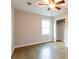 Bedroom with wood floors, ceiling fan and walk-in closet at 391 Oak Dr, Social Circle, GA 30025