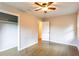 Bedroom featuring hardwood floors, ceiling fan and closet at 391 Oak Dr, Social Circle, GA 30025