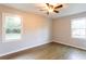 Bedroom featuring hardwood floors and two bright windows at 391 Oak Dr, Social Circle, GA 30025