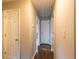 Hallway with clean white doors and beige walls at 391 Oak Dr, Social Circle, GA 30025