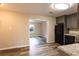 Open concept kitchen view showcasing the dining area and featuring gray cabinets and modern appliances at 391 Oak Dr, Social Circle, GA 30025