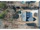 Stunning aerial view of the home with a private pool, landscaped yard, and long driveway at 105 Crown Ln, Woodstock, GA 30188