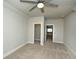 Comfortable bedroom with neutral carpet, ceiling fan, and view to other rooms, plus closet at 105 Crown Ln, Woodstock, GA 30188