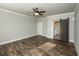 Bedroom with hardwood floors, ample natural light and a barn door leading to an en suite bath at 105 Crown Ln, Woodstock, GA 30188