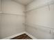 Walk-in closet with white wire shelving and wood flooring at 105 Crown Ln, Woodstock, GA 30188