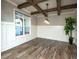 Elegant dining room featuring wood floors, coffered ceilings, and ample natural light at 105 Crown Ln, Woodstock, GA 30188