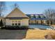 Inviting home with dormers and a covered porch, set on a well-maintained lawn at 105 Crown Ln, Woodstock, GA 30188