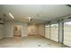 Spacious garage with high ceilings, updated doors, and ample storage, ideal for vehicles and projects at 105 Crown Ln, Woodstock, GA 30188