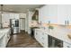 Modern kitchen with sleek countertops, stainless steel appliances, and ample storage space for culinary enthusiasts at 105 Crown Ln, Woodstock, GA 30188