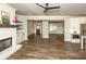 Open-concept living room with fireplace and hardwood floors, offering a bright and airy space for relaxing at 105 Crown Ln, Woodstock, GA 30188