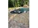Lounge chairs sit in the shallow end of this stunning pool with stone accents and rock waterfall feature at 105 Crown Ln, Woodstock, GA 30188