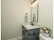 Elegant powder room with granite countertop, stylish faucet, and charming decor at 105 Crown Ln, Woodstock, GA 30188