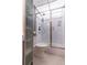 Well-designed bathroom with tiled floors and a glass-enclosed shower at 32 Peachtree Nw St # 1105, Atlanta, GA 30303