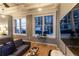 Modern bedroom featuring a seating area, large windows, and open city views at 32 Peachtree Nw St # 1105, Atlanta, GA 30303