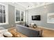 Cozy bedroom featuring a seating area, large windows, and city views at 32 Peachtree Nw St # 1105, Atlanta, GA 30303