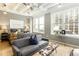 Bright bedroom with large windows, a comfortable seating area, and minimalist decor at 32 Peachtree Nw St # 1105, Atlanta, GA 30303