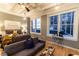 Inviting bedroom with a seating area, offering city views through large windows at 32 Peachtree Nw St # 1105, Atlanta, GA 30303