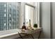 Condo living area featuring cityscape view with liquor and glasses for entertaining at 32 Peachtree Nw St # 1105, Atlanta, GA 30303