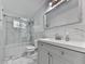 Modern bathroom with marble tile, sleek vanity, and glass-enclosed shower offering a luxurious experience at 6700 Roswell Rd # 24E, Atlanta, GA 30328
