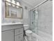 Bright bathroom featuring modern fixtures, a tiled shower, and vanity with ample storage space at 6700 Roswell Rd # 24E, Atlanta, GA 30328