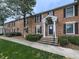 Charming brick home with a welcoming entrance, complemented by lush greenery and well-maintained landscaping at 6700 Roswell Rd # 24E, Atlanta, GA 30328