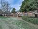Brick apartment buildings with manicured lawns and trees at 6700 Roswell Rd # 24E, Atlanta, GA 30328
