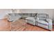 Spacious living room featuring a large sectional sofa and hardwood flooring for a comfortable and stylish space at 6700 Roswell Rd # 24E, Atlanta, GA 30328