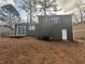 View of backyard and exterior of the house at 885 Hemingway Rd, Stone Mountain, GA 30088