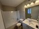 This full bathroom features a shower and tub combination and a single sink vanity at 885 Hemingway Rd, Stone Mountain, GA 30088