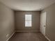 This cozy bedroom has a window that allows natural light to fill the room at 885 Hemingway Rd, Stone Mountain, GA 30088