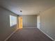 This bedroom features neutral walls, plush carpet, and a window for natural light at 885 Hemingway Rd, Stone Mountain, GA 30088