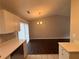 A neutral dining room with hardwood floors and modern chandelier at 885 Hemingway Rd, Stone Mountain, GA 30088