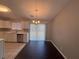 A neutral dining room with hardwood floors and sliding door at 885 Hemingway Rd, Stone Mountain, GA 30088