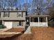 Charming two-story home featuring a front porch and attached garage at 885 Hemingway Rd, Stone Mountain, GA 30088