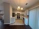 Modern kitchen featuring white cabinets and stainless steel appliances at 885 Hemingway Rd, Stone Mountain, GA 30088