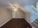 Spacious living room with sleek flooring, bright windows and staircase access at 885 Hemingway Rd, Stone Mountain, GA 30088
