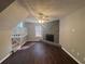 Cozy living room with a stone fireplace and hardwood floors at 885 Hemingway Rd, Stone Mountain, GA 30088